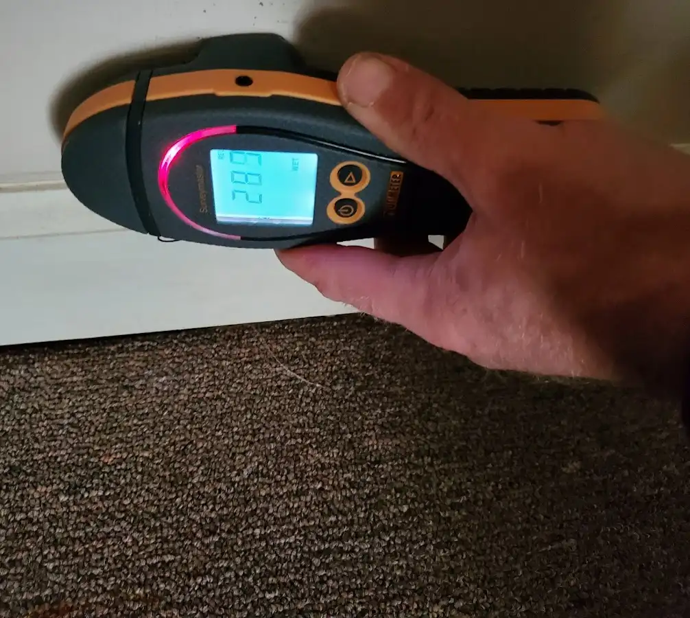 Moisture detection at baseboard during Storm Damage Restoration in Goodlettsville